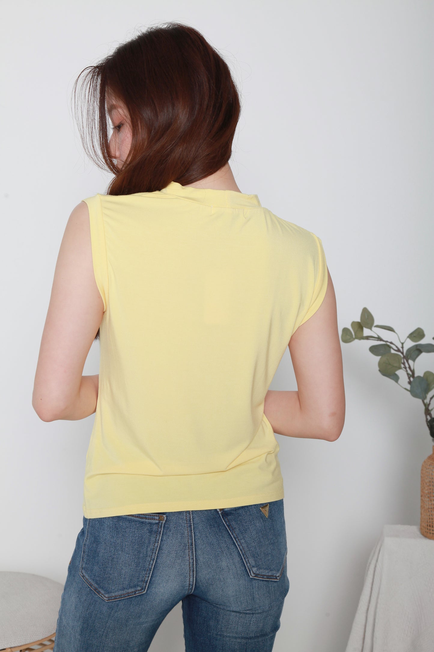 sleeveless top in yellow color