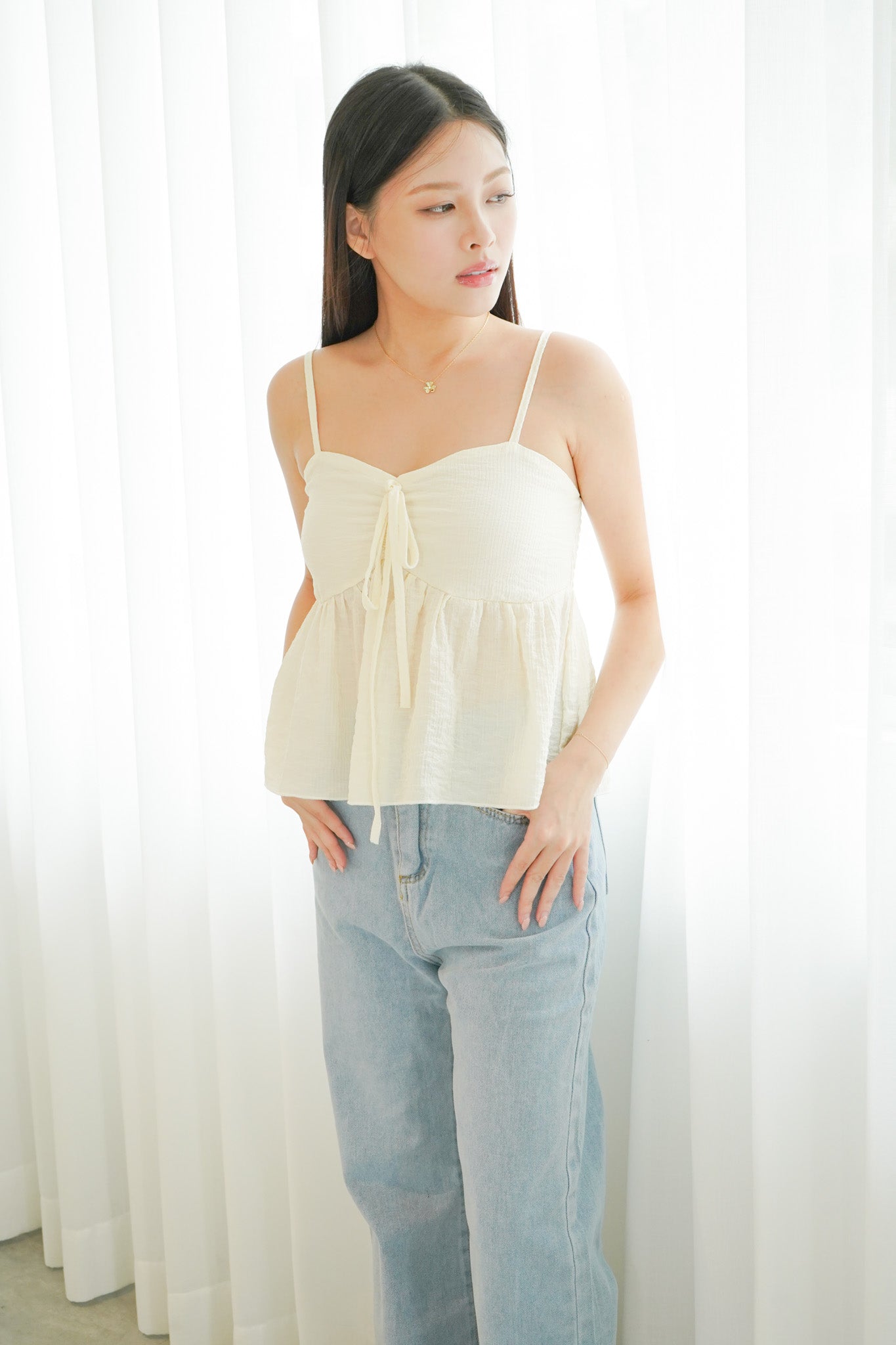 Chantria Ruffle Sleeveless Top (Champagne)